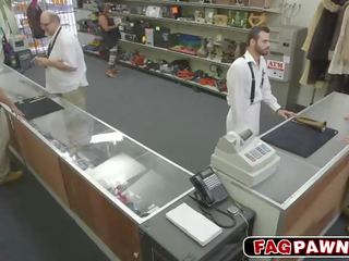 Dude blows a cock behind counter in a shop